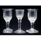 An 18th century facet stem wine glass, the ogee bowl with lens and star cut border to the rim,