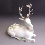 A Meissen 19th Century tureen and cover modelled as a recumbent stag, 19th Century, blue crossed