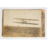 An early 1909 original photograph of an aircraft, attached to card backing as a New Years 1909