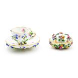 A Meissen flower encrusted cup and saucer, 19th Century, blue crossed swords mark ,diameter of