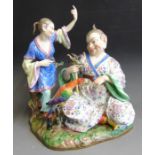 A very large Meissen pagoda figural group, the Chinese man sitting holding a stick with a dragon