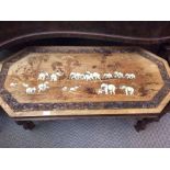 A Chinese hardwood oblong inlaid low table, depicting herds of elephants in ivorine inlay, carved