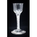 An 18th century opaque twist wine glass, the ogee bowl on a double lattice and double helix core