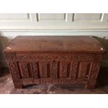 An early to mid 18th Century oak joined lidded chest, plank top, enclosing two candleboxes, the