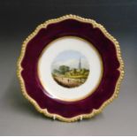 A  Flight Barr and Barr cabinet plate, deep claret ground and gild rope rim, painted with a view