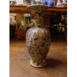 A famille rose canton vase depicting interior scenes of important family, with ladies and