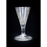 An 18th century wine glass, the conical bowl on plain stem and folded foot, 12cm high, 5.8cm