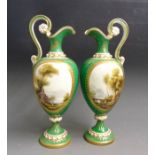 A pair of Royal Worcester green ground ewers, painted with landscapes signed by H Davis and gilt