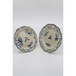 Two creamware blue and white plates, feather edged border, decorated with floral sprigs and swags,