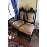 A pair of late 19th century carved and upholstered side chairs (2)