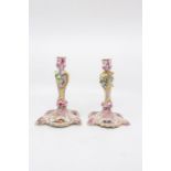 A pair of Berlin candlesticks hand painted with Watteau style scenes. Circa mid 19th century Size
