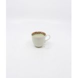 A Worcester ribbed body Coffee Cup with a floral decorated inner rim. Circa 1770. Size 6.3cm.