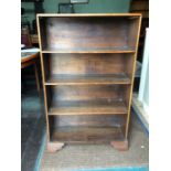 An early 20th Century oak bookcase, open form, fitted with four shelves, 115cm high, 69cm wide, 25cm