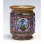 A Della Robia Arts & Crafts pot, circa 1900, of straight sided form, the frieze a roundel of an