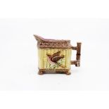 Majolica milk jug, with moulded rattan and bird motif and bamboo handle.