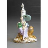 A Meissen Allegory figure of ‘Peace’, a maiden sitting  on a lion with a book in her hand in front