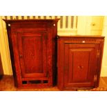 A George III oak and mahogany hanging corner cupboard, together with a further Georgian hanging