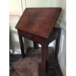 A George III mahogany Architect's desk, circa 1780, the top with a hinged top, the drawer having a