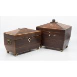 A pair of tea caddy's of sarcophagus design with twin compartments.