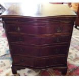 A George III style mahogany serpentine fronted chest of drawers, of recent manufacture, fitted