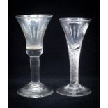 An 18th century wine glass, the bell shaped bowl on plain stem and domed foot, 16.5cm high, 7.8cm