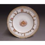 A Meissen cabinet plate, painted with two putto sitting in clouds, with a border decorated with