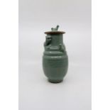 **WITHDRAWN** A 20th century southern Song style celedon glazed, lidded funerary urn, moulded