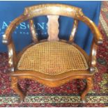 A late 18th Century Dutch walnut and floral marquetry inlaid desk chair, canework seat, raised on