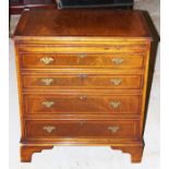 A Georgian style chest of drawers, fitted with a b