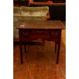 A George III country oak lowboy, circa 1760, crossbanded with triple frieze drawers, shaped apron,