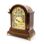 An Edwardian mahogany cased bracket clock, of 18th Century design, arched top, gilt metal finials,