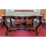 A 19th Century Louis Phillipe ebonised and brass writing table, raised on French cabriole legs, 76cm