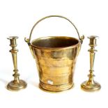 A Regency brass bucket, concentric turned decoration and attached foot, with simple lop handle, 25cm