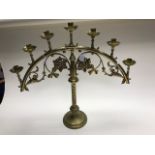 A pair of late 19th Century brass ecclesiastical seven light candelabra, attributed to John