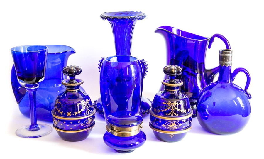 Bristol blue glass to include jugs, vases, drinking glass, pair of decanters with gilt detailing etc