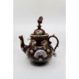 A Measham Bargeware teapot, inscribed 'A present from Burton on Trent 1881', Height 34 cms, finial