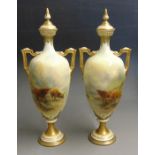 A pair of Royal Worcester twin handled vases and covers, painted with Highland cattle and signed