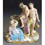 A Meissen figure group depicting a drunken Silenus on a donkey being supported by Bacchus and