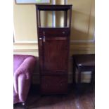 An early 19th Century mahogany what-not, the upper section raised over a shelf below, small drawer