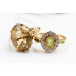 Two 9ct gold dress rings comprising a peridot and diamond ring, size Q,