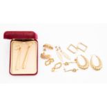 A collection of seven pairs of 9ct gold and yellow metal earrings, pierced fittings,