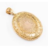 A 9ct gold large oval locket foliate decoration, approx. 35mm x 40mm, weight approx. 17.7gms.