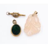 Carved rose quartz pendant with gold bale,