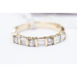 A 14ct gold and diamond half eternity ring,