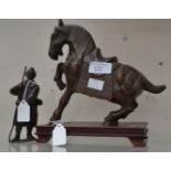 A 19th Century figure of a Chinese man with a bronze Chinese horse on stand