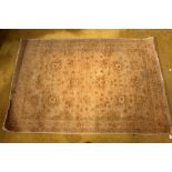 A cream woollen Persian rug,