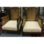 A pair of Victorian Oak rushed back low seated Armchair.
