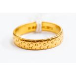A 22ct gold wedding band engraved details, size O, total gross weight approx. 3.