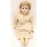 KAMMER REINHARDT: A reproduction bisque head Kammer Reinhardt girl doll, open eyes, closed mouth,