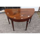 A Edwardian mahogany demi lune table